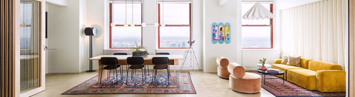 A well lit office overlooking a city skyline